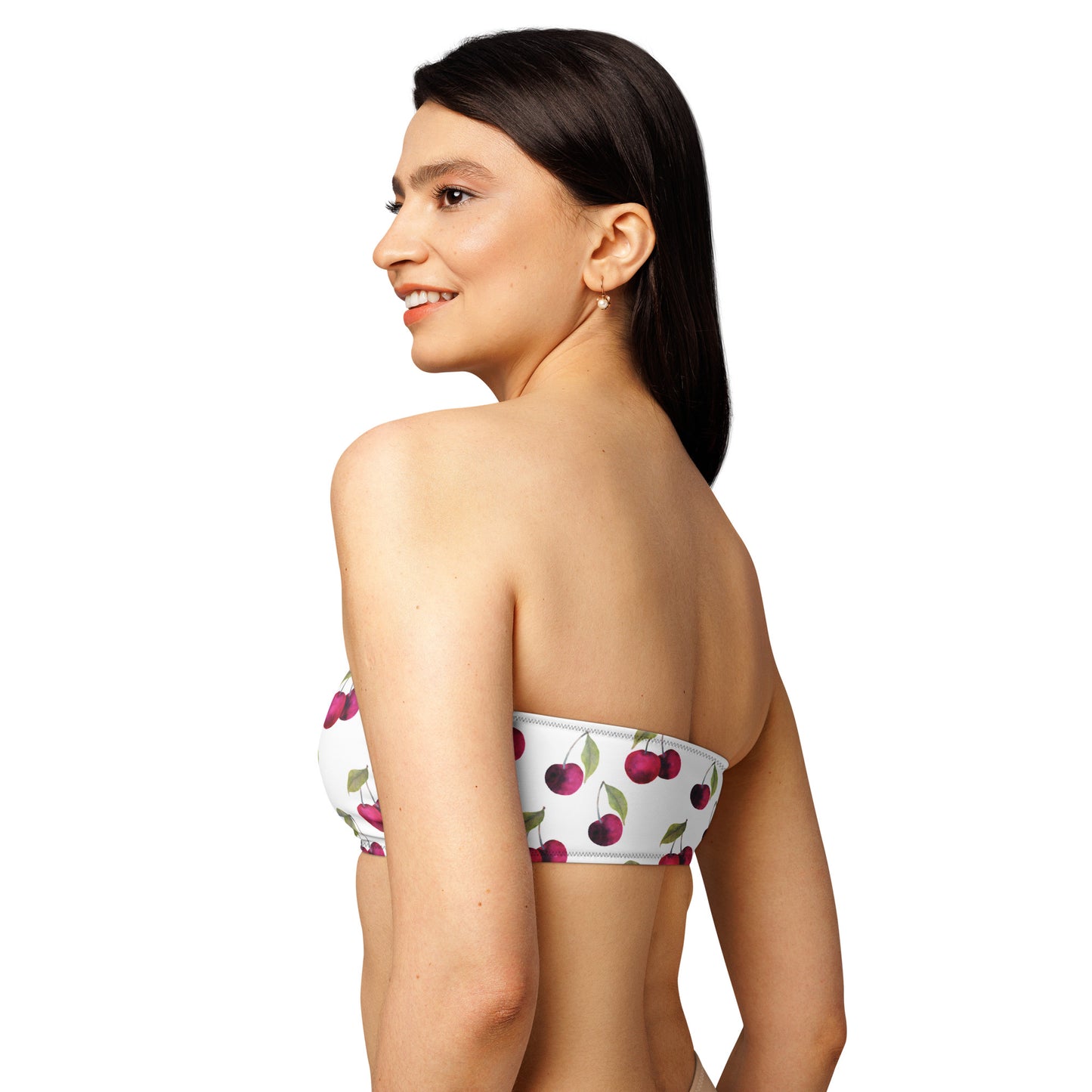 Rear view of woman wearing white bandeau bikini top with all-over cherries design.
