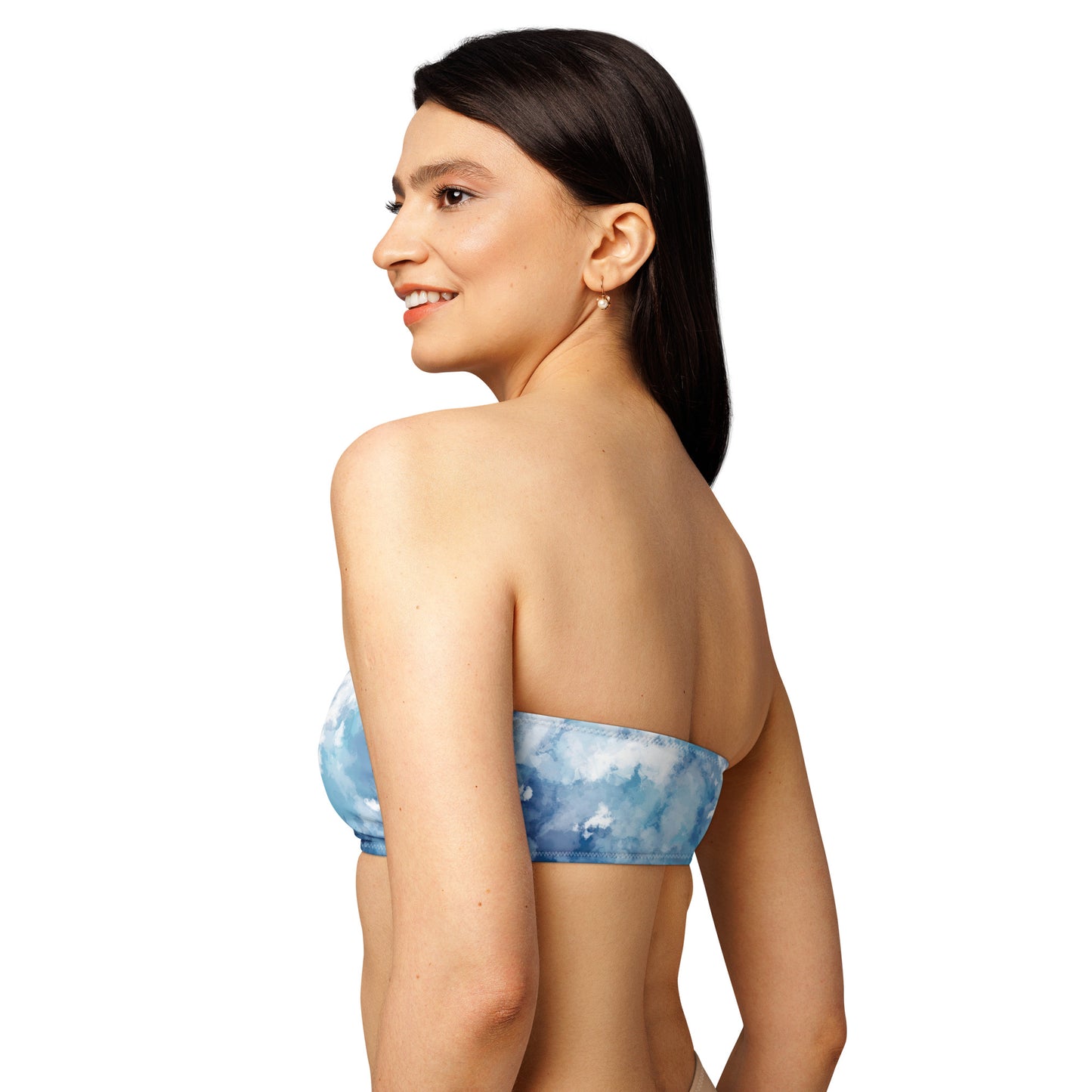 Rear view of woman wearing bandeau bikini top with a blue-white, watercolor-like design.