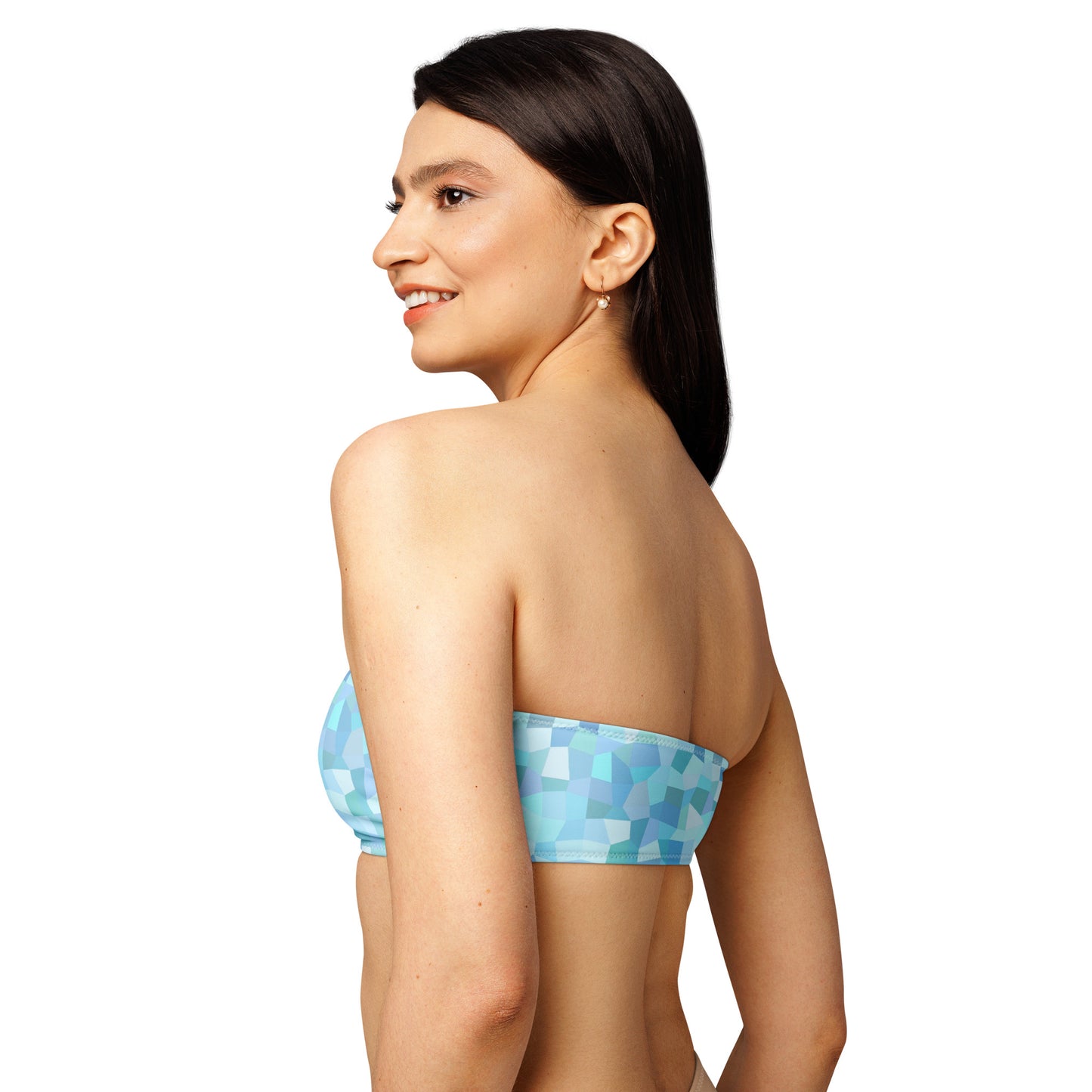 Rear view of woman wearing bandeau bikini top with cyan geometric pattern.
