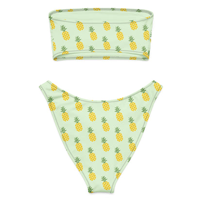 Back of bandeau bikini with an all-over pineapple design set on a light-green background.