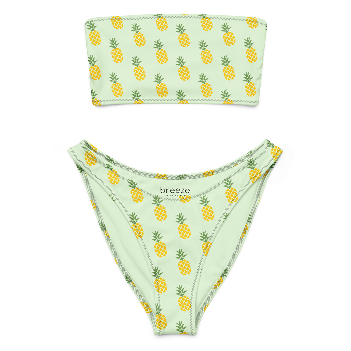 Bandeau bikini with an all-over pineapple design set on a light-green background.