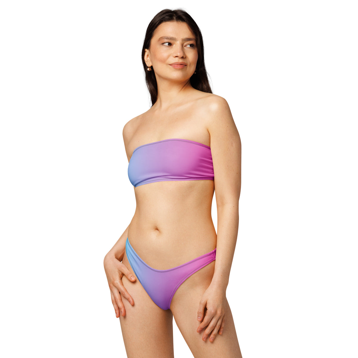 Woman wearing bandeau bikini with a blue-to-pink color pattern.