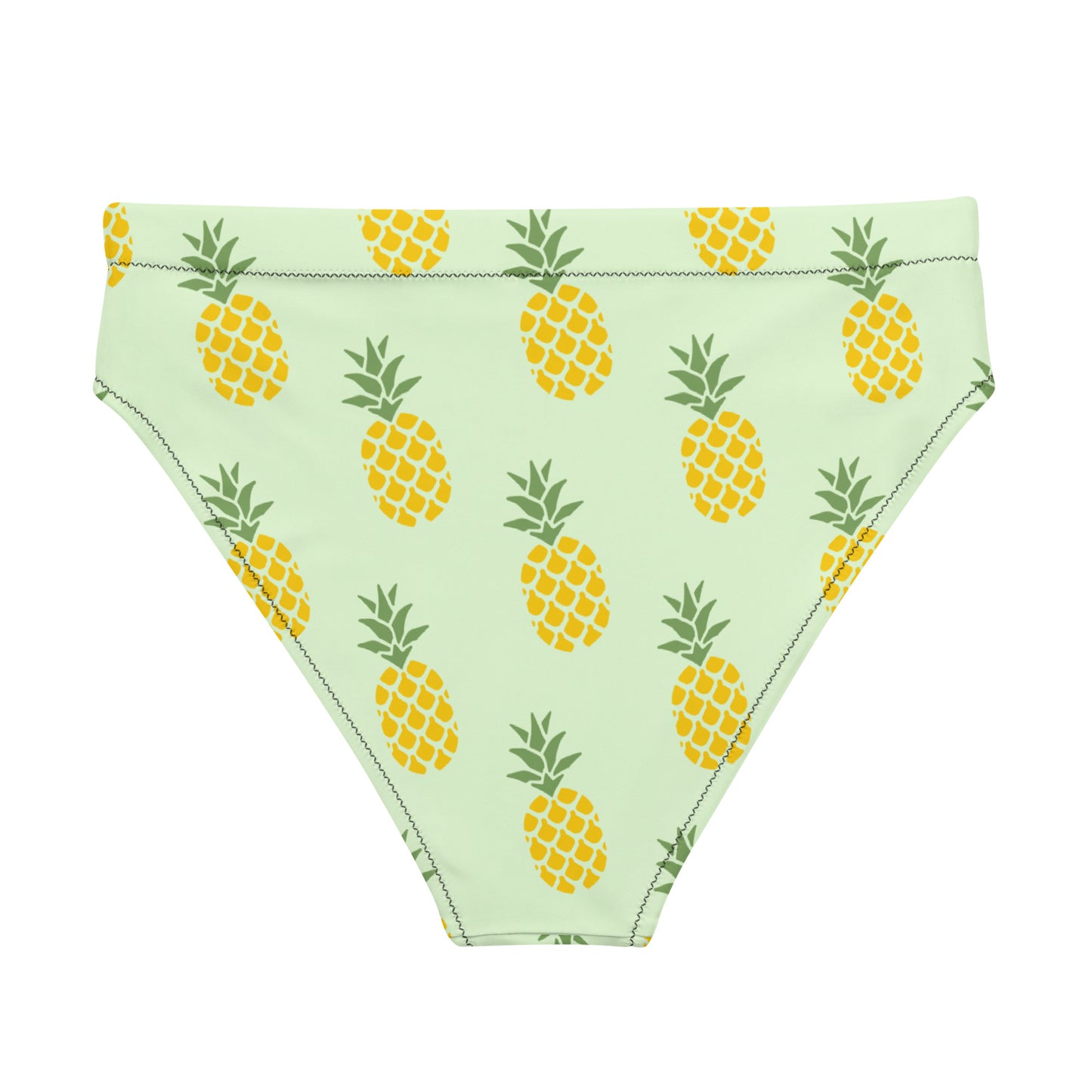 Back of bikini bottom with pineapple pattern set on a light-green background.