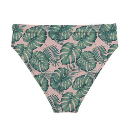 Back of bikini bottom with pattern of green palm leaves set on a pink background.