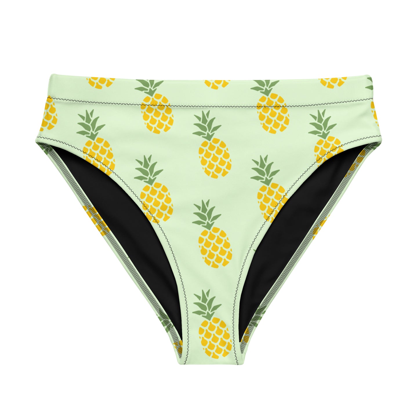 Bikini bottom with pineapple pattern set on a light-green background.