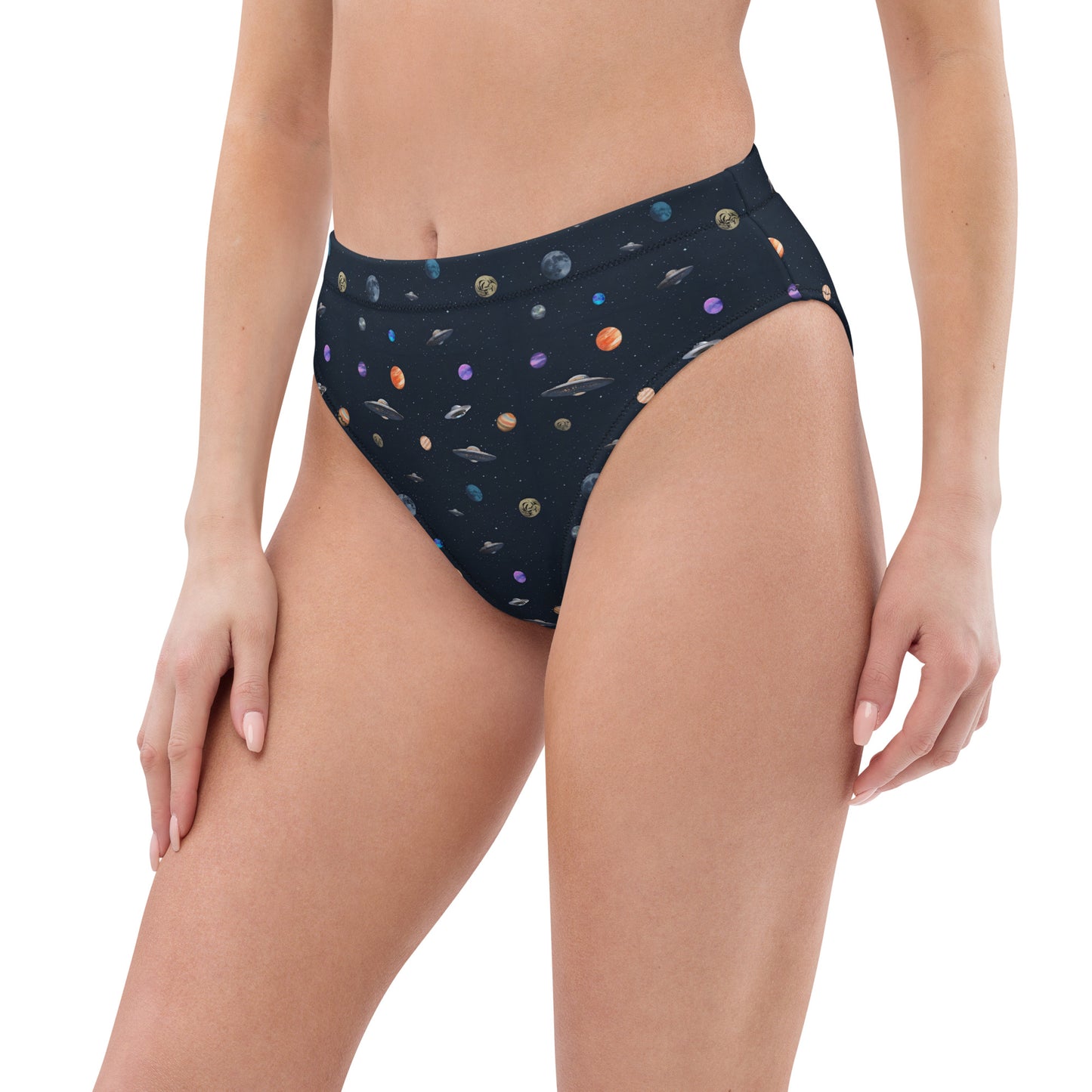 Woman wearing bikini bottom with pattern of UFOs and planets in space.