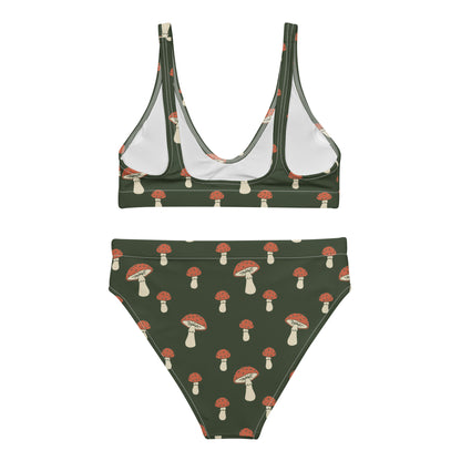 Back of bikini with pattern of mushrooms set on a green background.