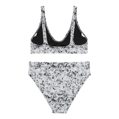 Back of bikini with pattern of black splotches set on a white background.