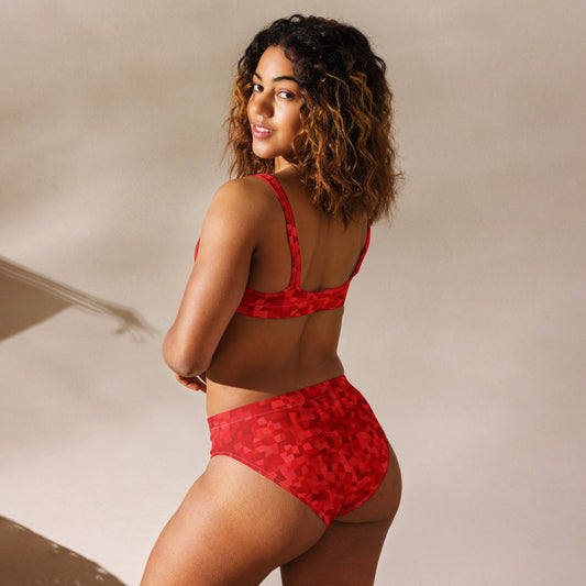Rear view of woman wearing bikini with red geometric pattern.