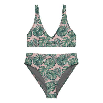 Bikini with pattern of green palm leaves set on a pink background.