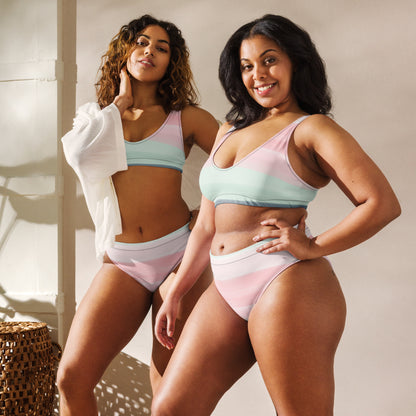 Two women, each wearing bikini with design resembling watercolor stripes. Main colors are light-green and pink.