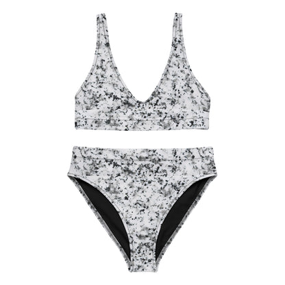Bikini with pattern of black splotches set on a white background.