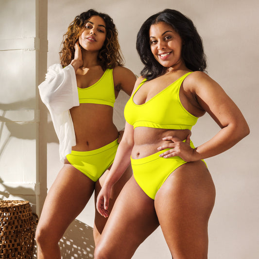 Two women, each wearing yellow bikini