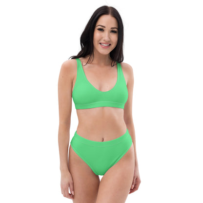 Woman wearing mint-green bikini.