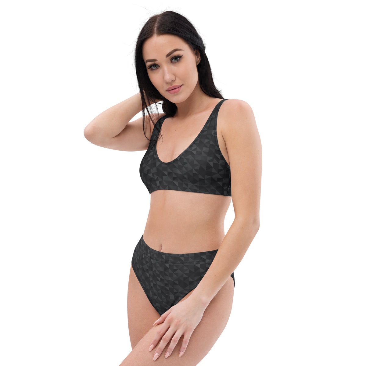 Woman wearing bikini with dark-gray geometric pattern.
