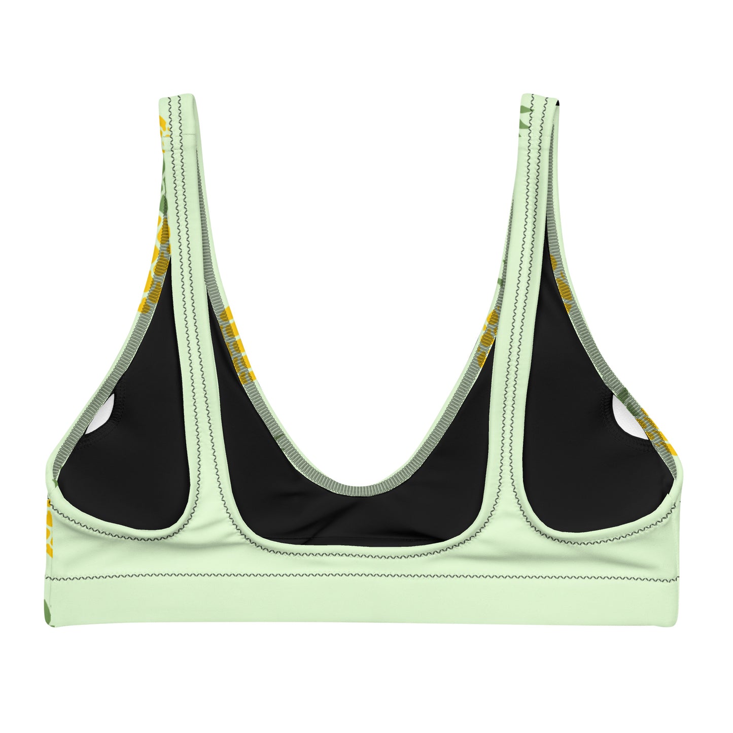 Back of bikini top with all-over pineapple pattern set on a light-green background.