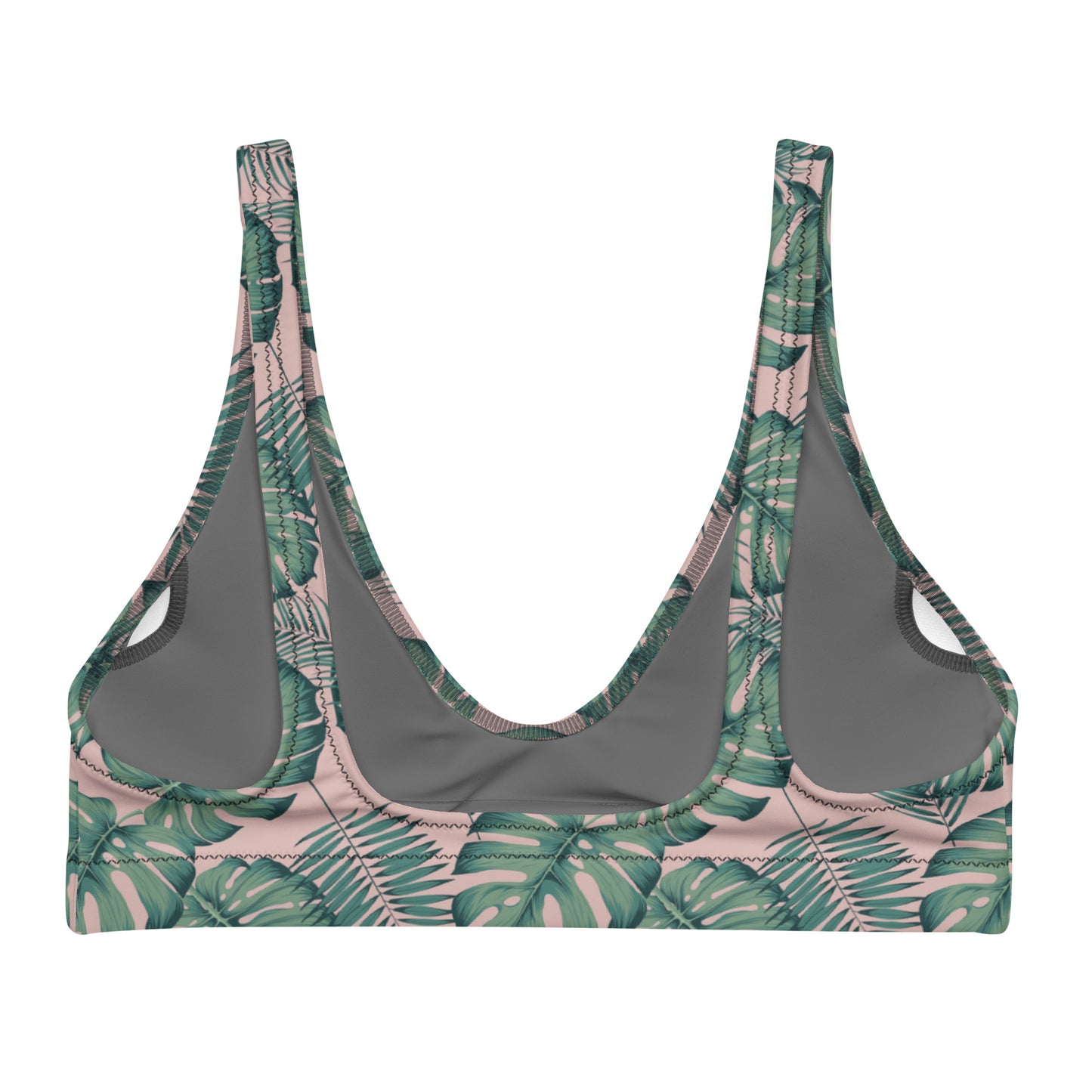 Back of bikini top with pattern of green palm leaves set on a pink background.