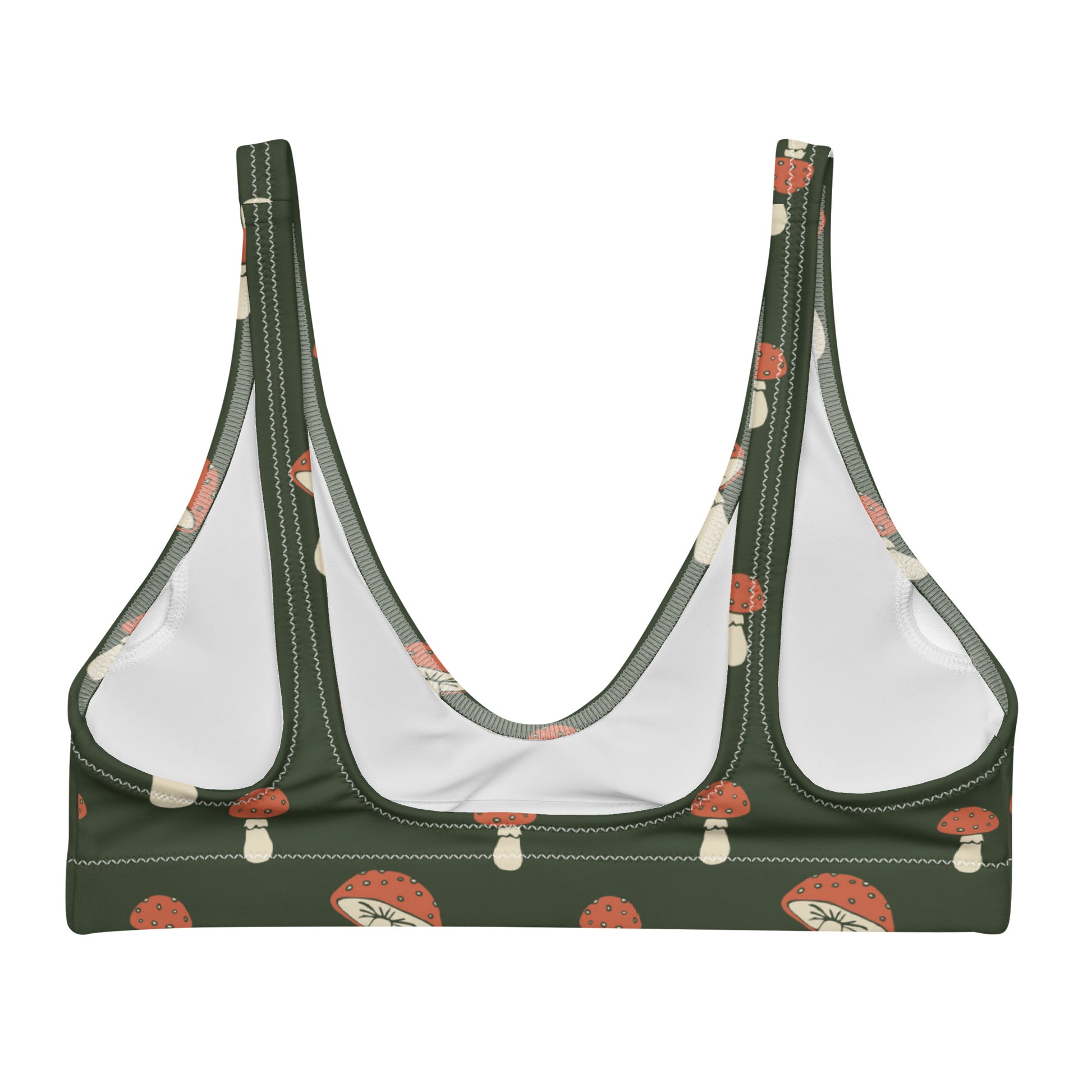 Back of bikini top with pattern of mushrooms set on a green background.
