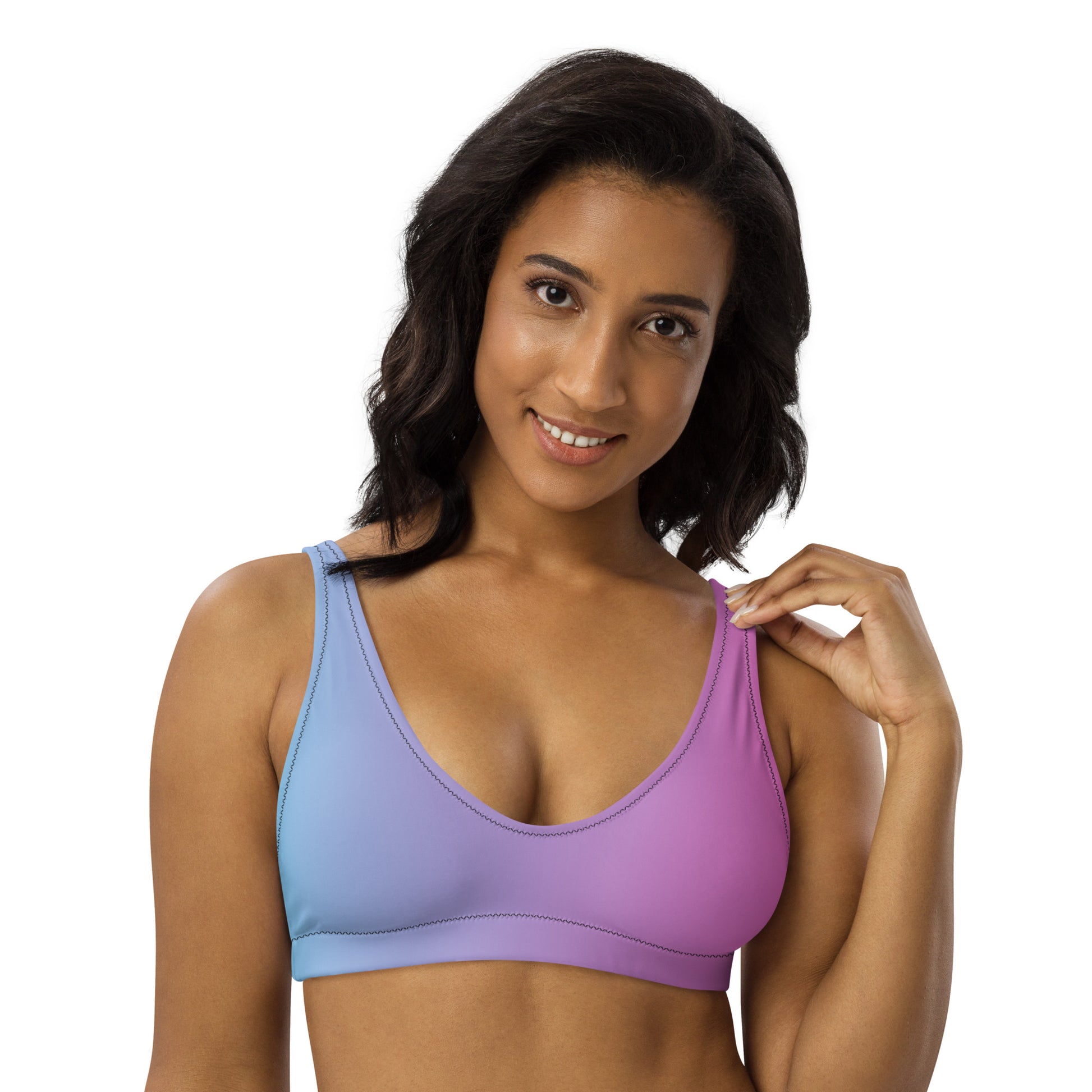 Woman wearing bikini top with blue-to-pink color scheme.