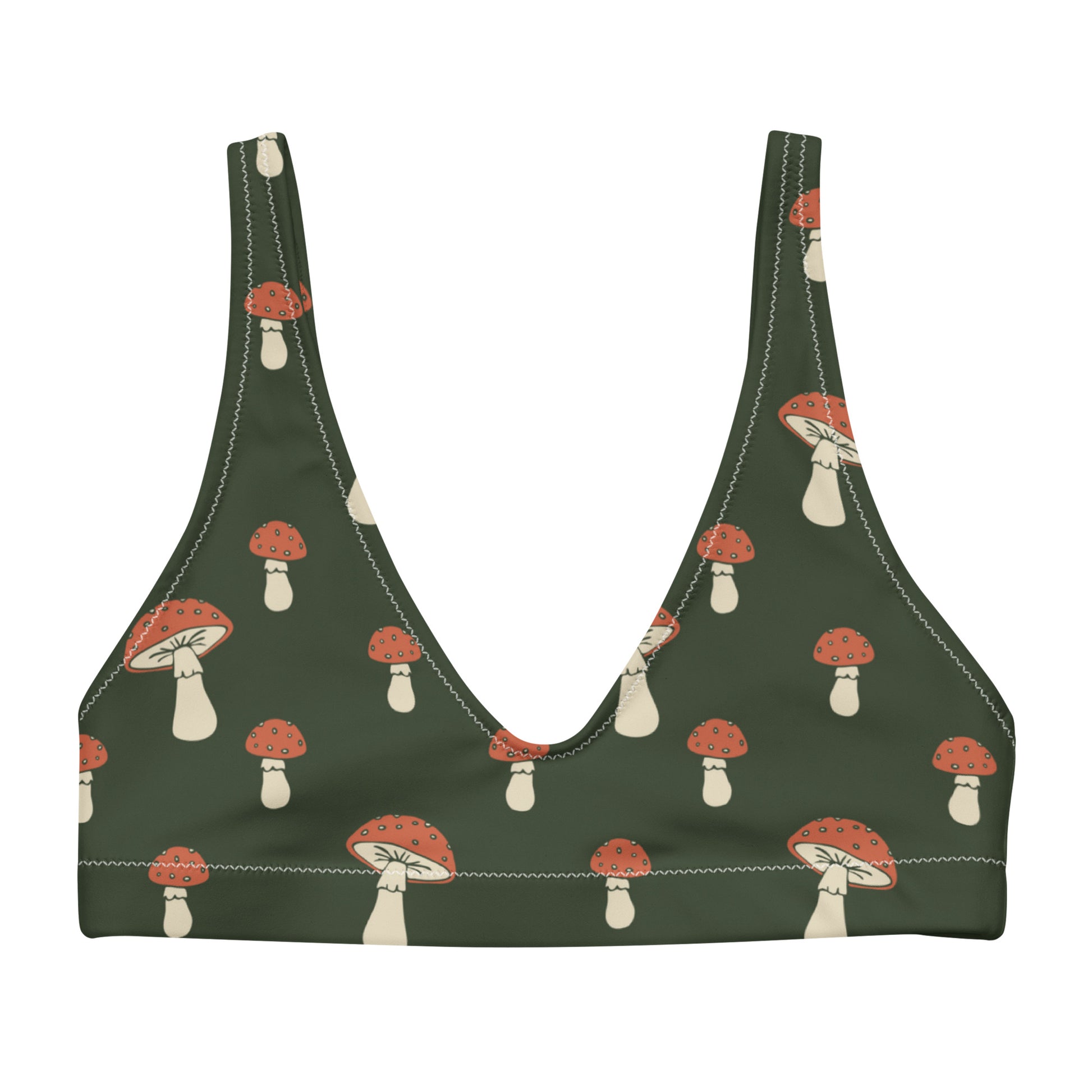 Bikini top with pattern of mushrooms set on a green background.