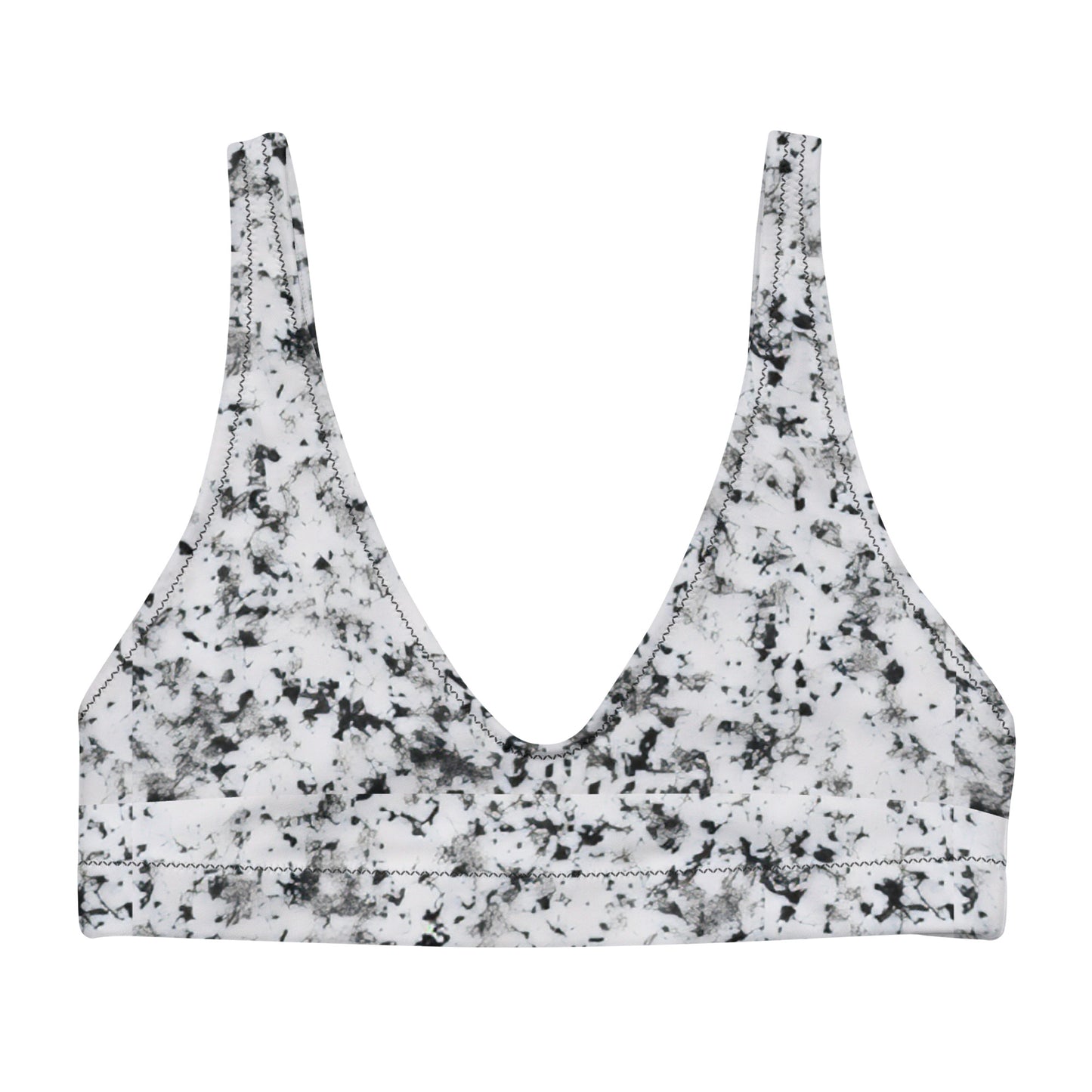 Bikini top with pattern of black splotches set on a white background.