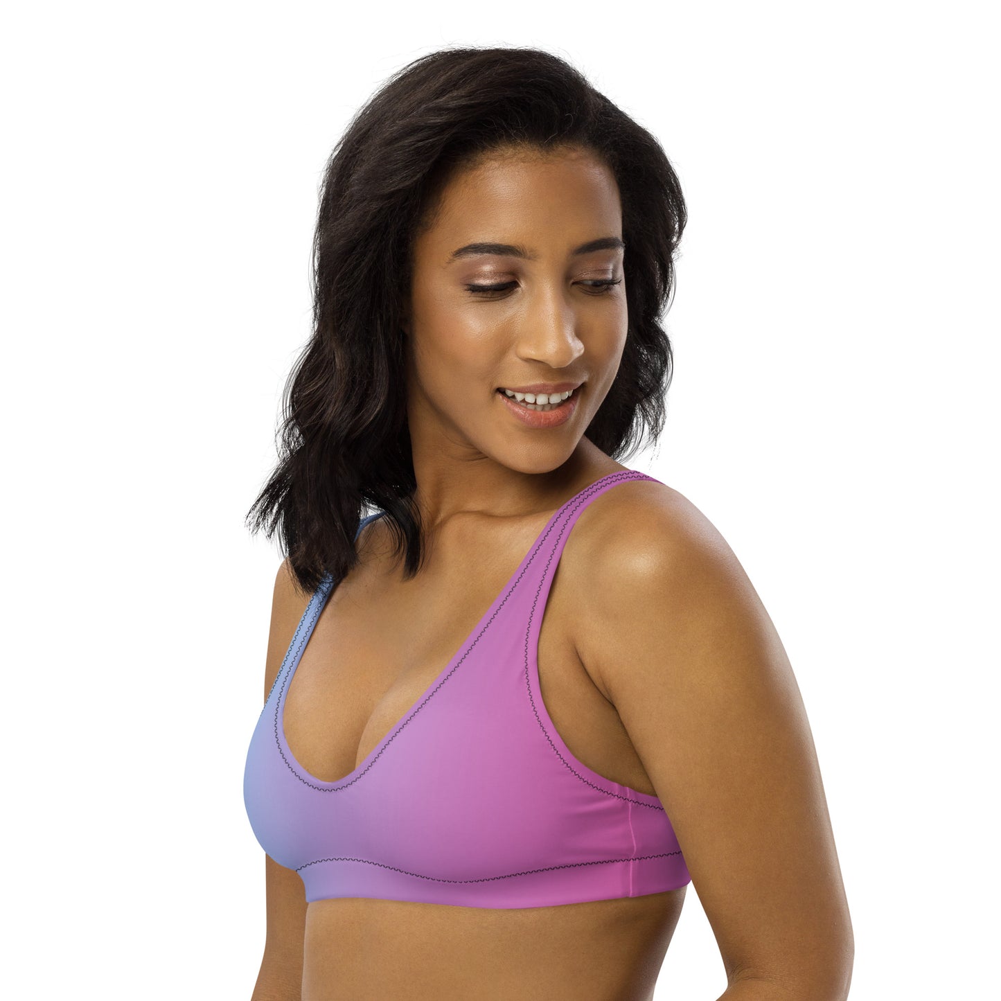 Woman wearing bikini top with blue-to-pink color scheme.