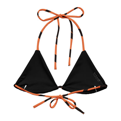 Back of bikini top with tigerskin pattern. Interior is black.