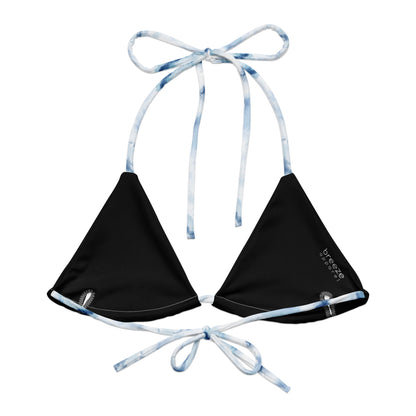 Bikini top with blue-white, watercolor-style design. Interior is black.