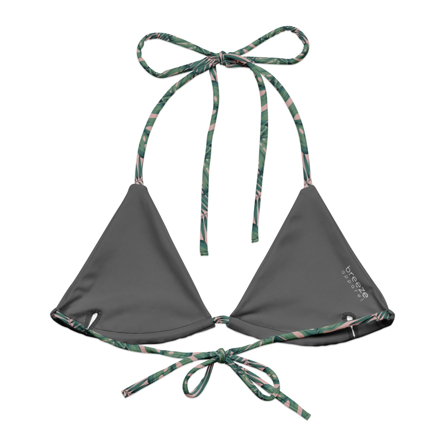 Back of bikini top with pattern of green palm leaves set on a pink background. Interior is gray.
