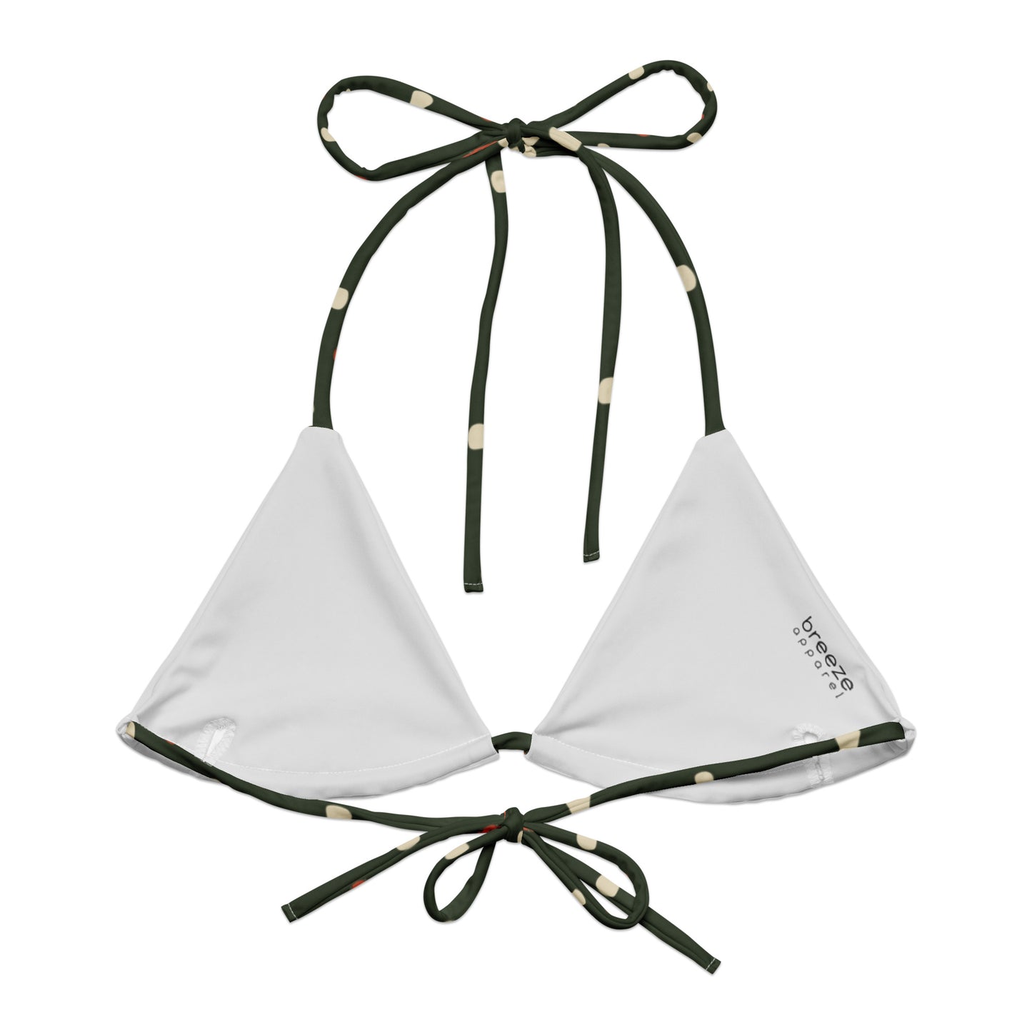 Back of bikini top with pattern of mushrooms set on a forest-green background. Interior is light gray.