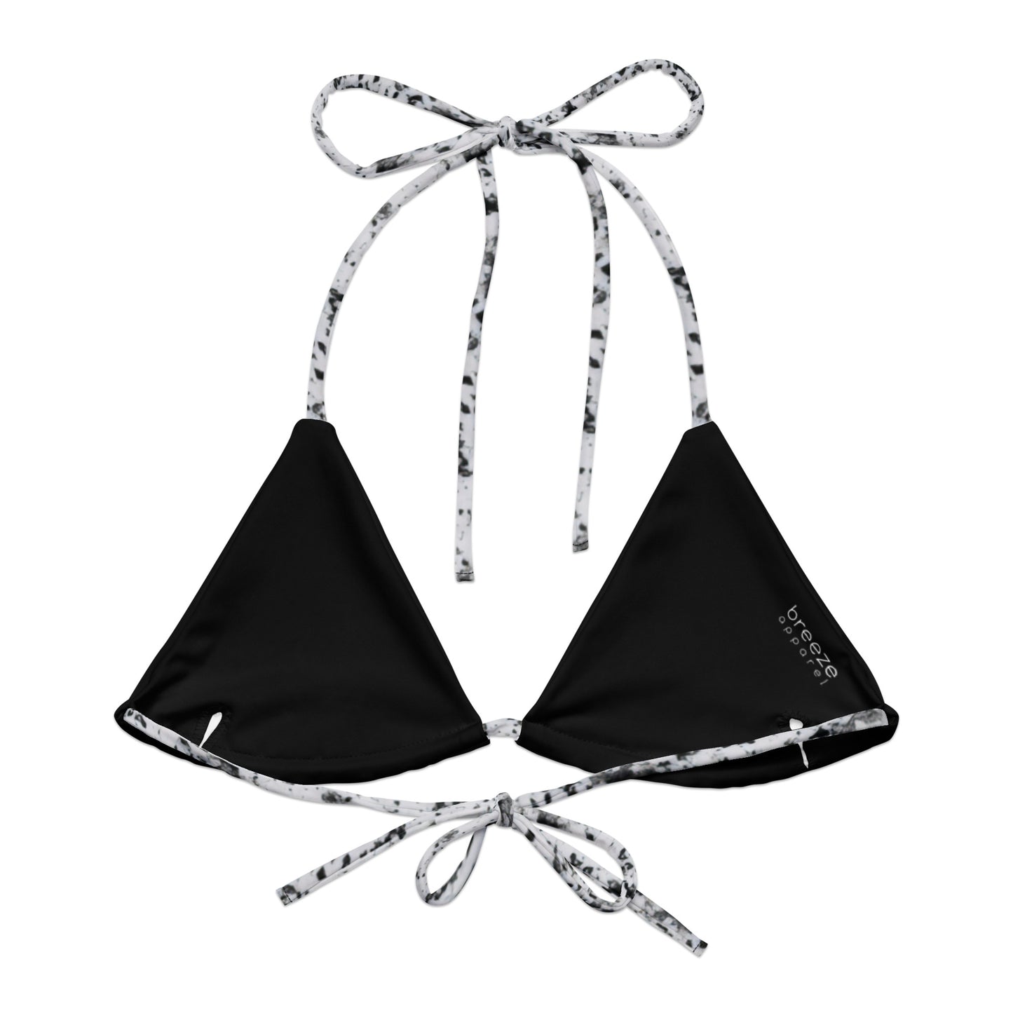 Back of bikini top with design of black splotches on a white background. Interior is black.