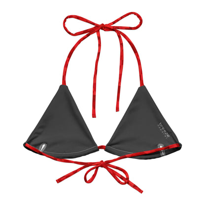 Back of bikini top with red geometric pattern. Interior is dark gray.