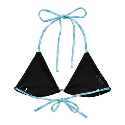 Back of bikini top with cyan geometric pattern. Interior is black.