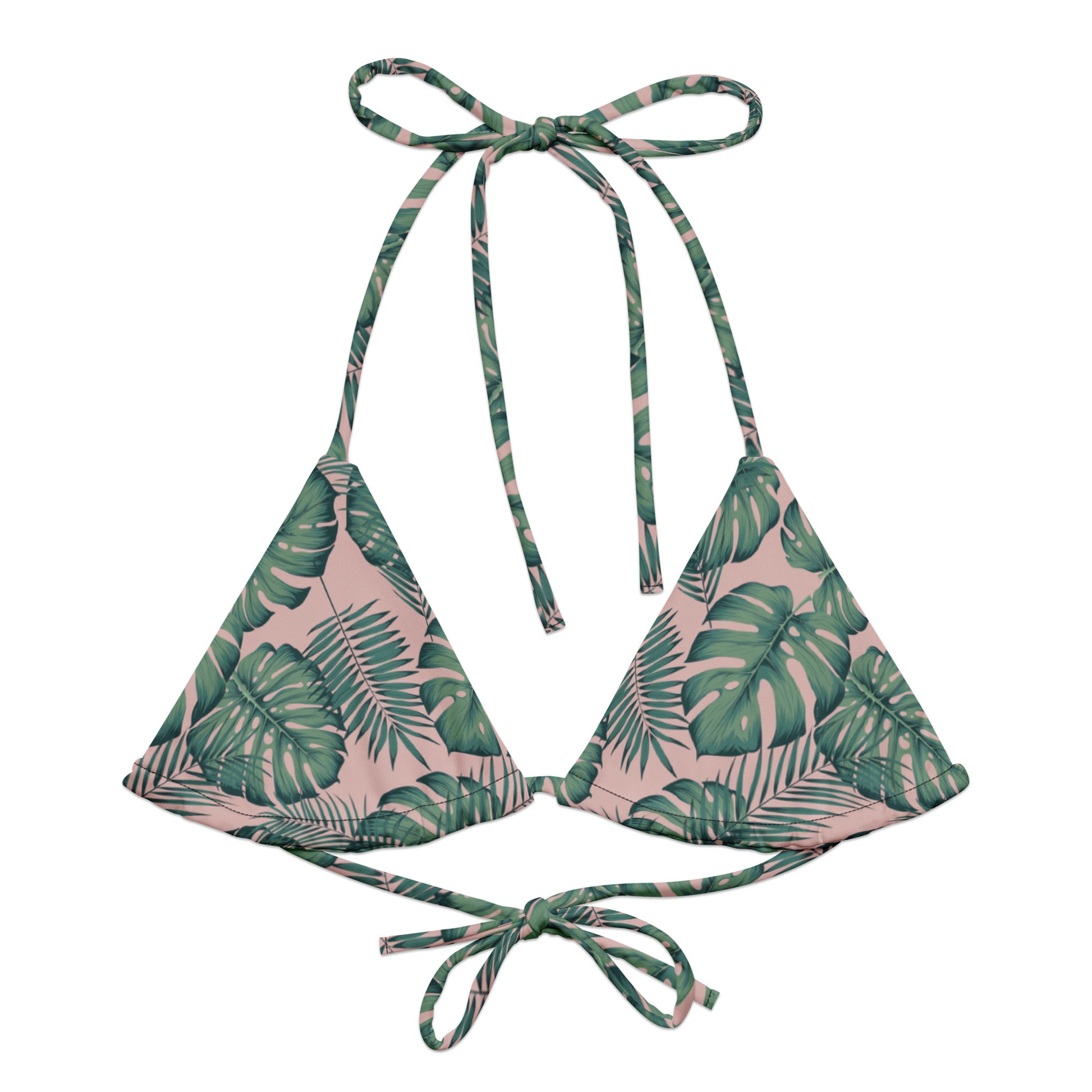 Bikini top with pattern of green palm leaves set on a pink background.