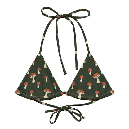 Bikini top with pattern of mushrooms set on a forest-green background.