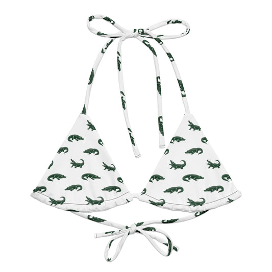 White bikini top with pattern of green alligators.