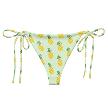 Back of light-green bikini bottom with all-over pineapple pattern.