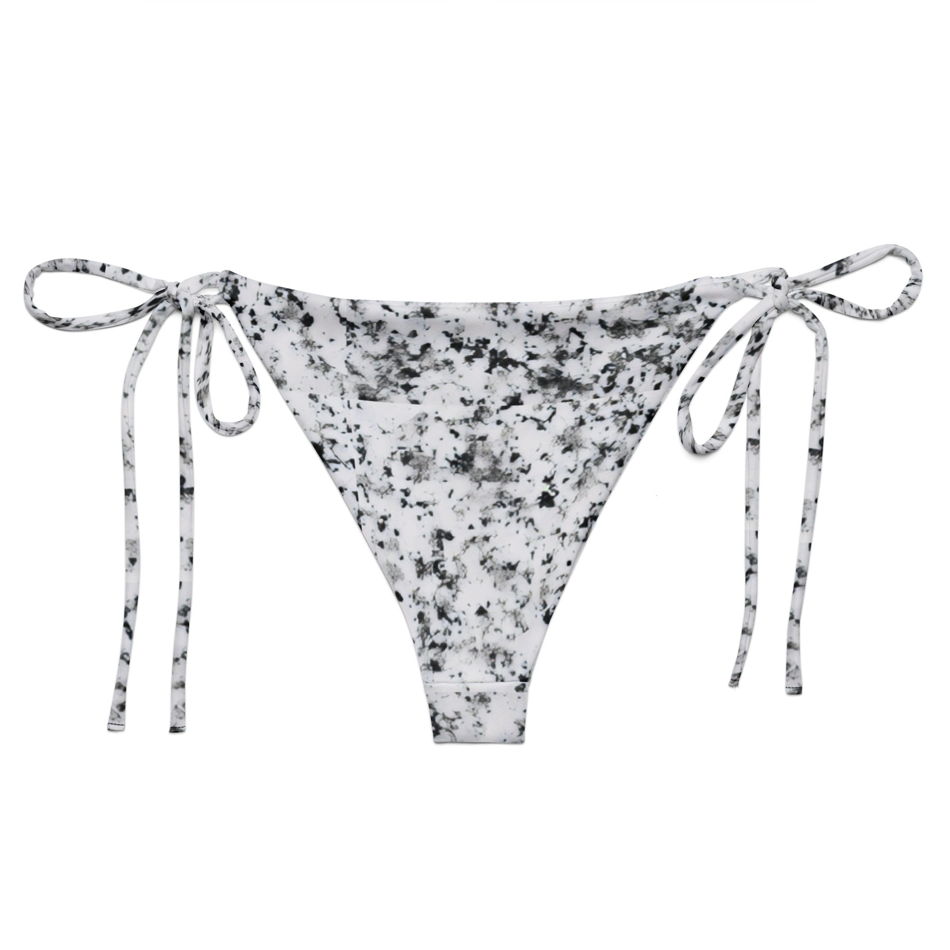 Back of bikini bottom with design of black splotches on a white background.