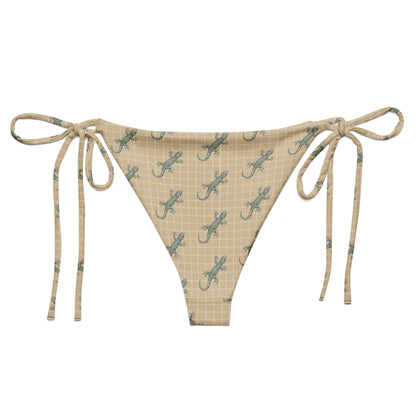 Beige bikini bottom with pattern of green geckos.