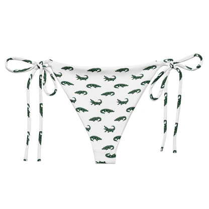 White bikini bottom with pattern of green alligators.