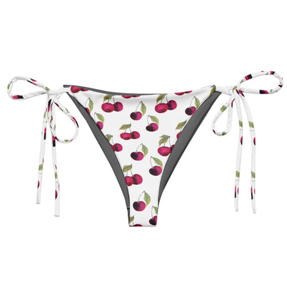Bikini bottom with all-over pattern of cherries set on a white background.
