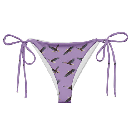 Purple bikini bottom with pattern of bald eagles.