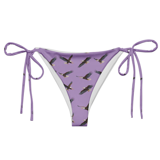 Purple bikini bottom with pattern of bald eagles.