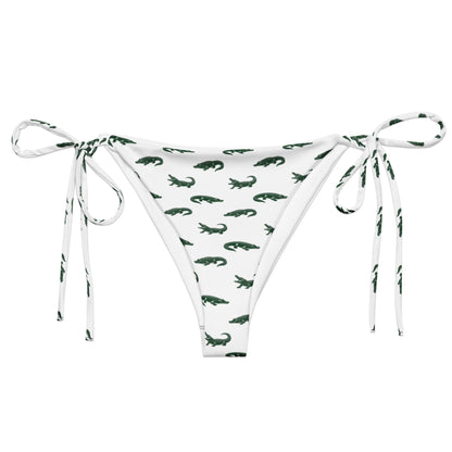 White bikini bottom with pattern of green alligators.