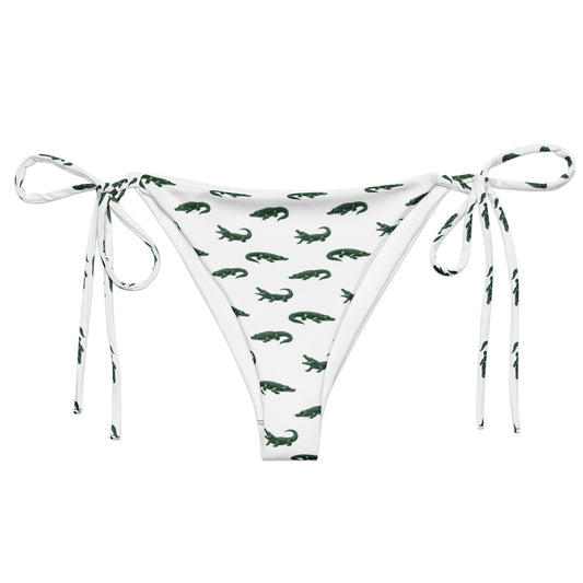 White bikini bottom with pattern of green alligators.