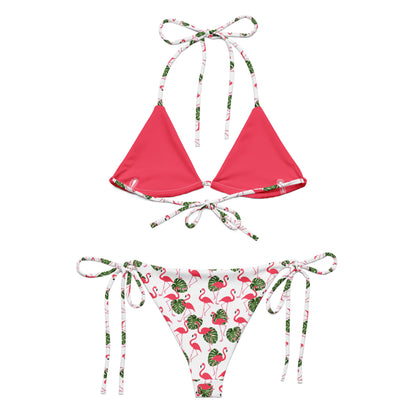 Back of bikini with flamingo pattern set on white background. Interior is pink.