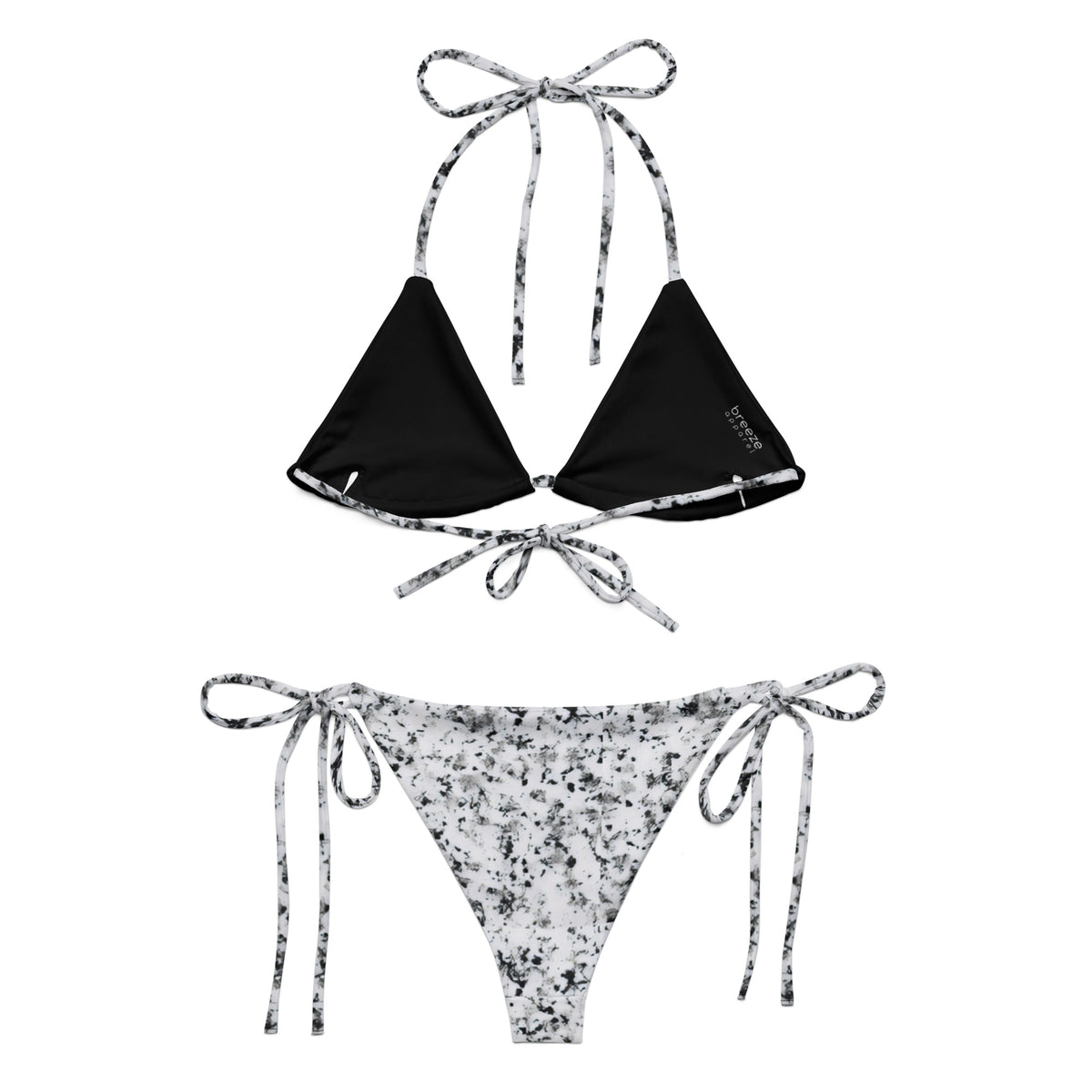 Back of bikini with design of black splotches on a white background. Interior is black.