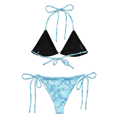 Back of bikini with cyan geometric pattern. Interior is black.