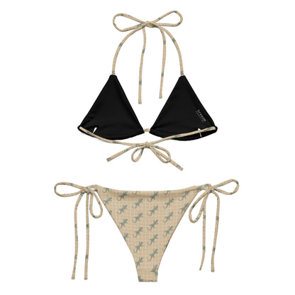 Beige bikini with pattern of green lizards.