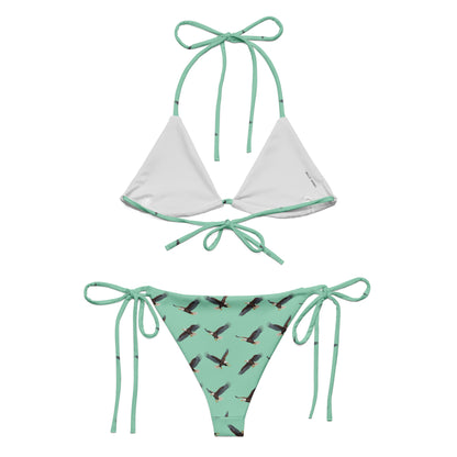Green bikini with pattern of bald eagles.